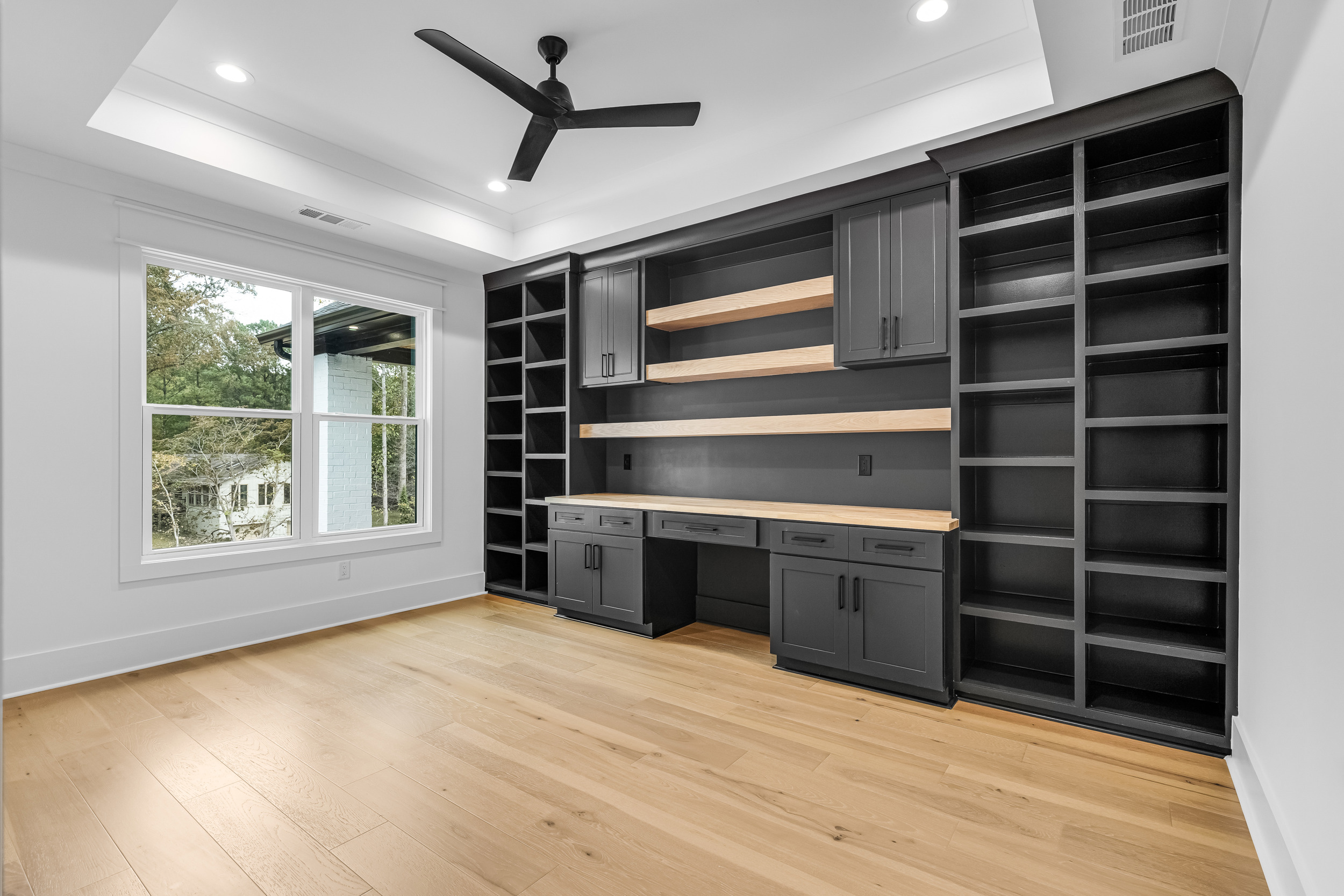 Home office with built-in cabinetry